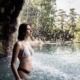 A girl relaxing at Villa dei Cedri Thermal Park near Lake Garda.