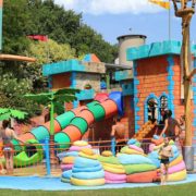 Kids playing in the water attractions at Quiete Aquapark near Lake Garda