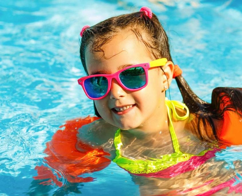 A girl swimming in an aquapark at Lake Garda