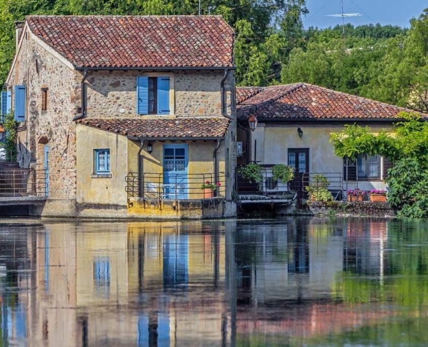 Charming small stone houses of Borghetto sul Mincio, nestled along the Mincio River.