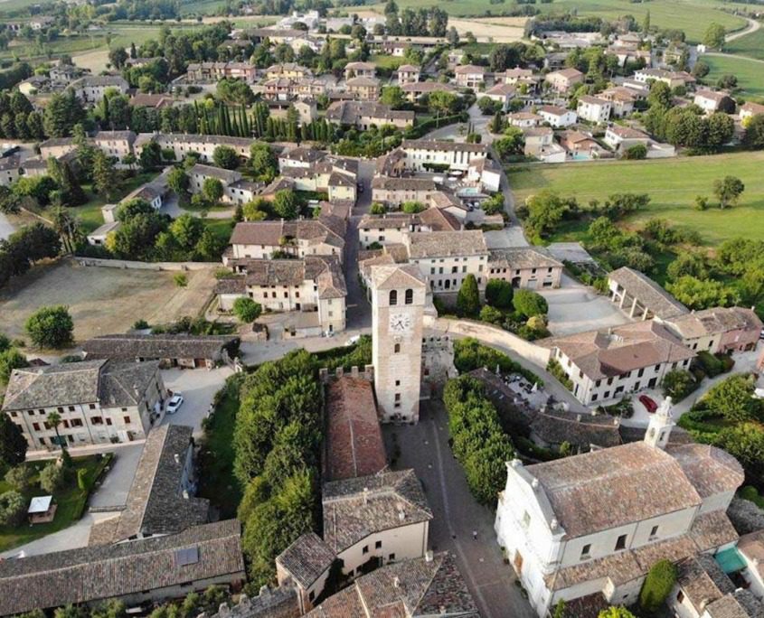 Aerial view of Castellaro Lagusello, one of Lake Garda's hidden medieval gems.