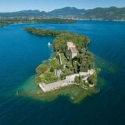 Aerial view of Isola del Garda surrounded by Lake Garda.