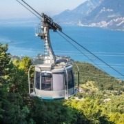 View of the rotating cable car cabin from Monte Baldo, overlooking Lake Garda.