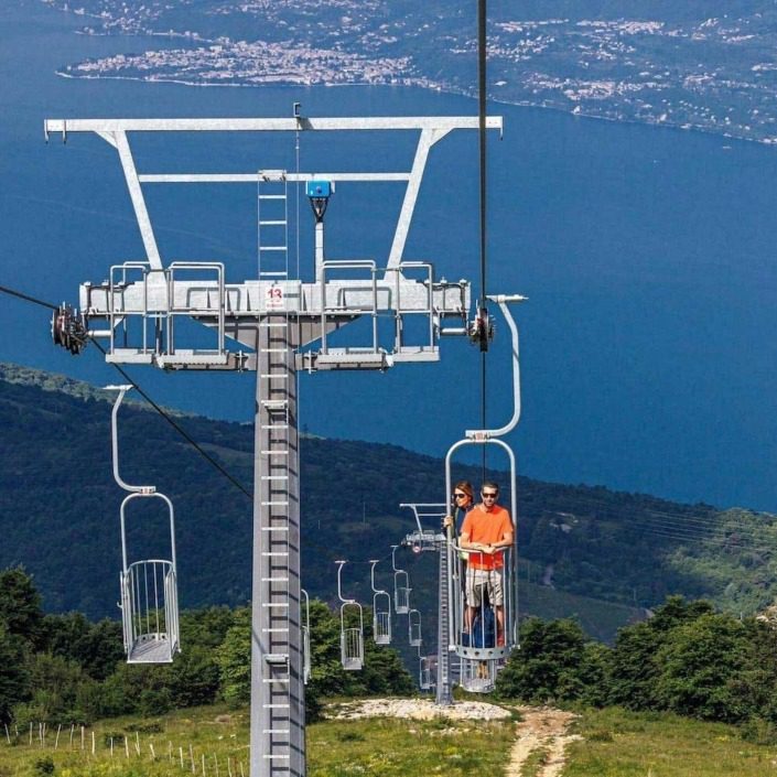 Aerial view of Lake Garda and the cable car from Prada to Costabella.