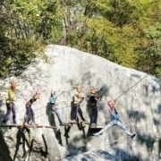 A group of people enjoying the adventure path at Elias Adventure Park near Lake Garda.