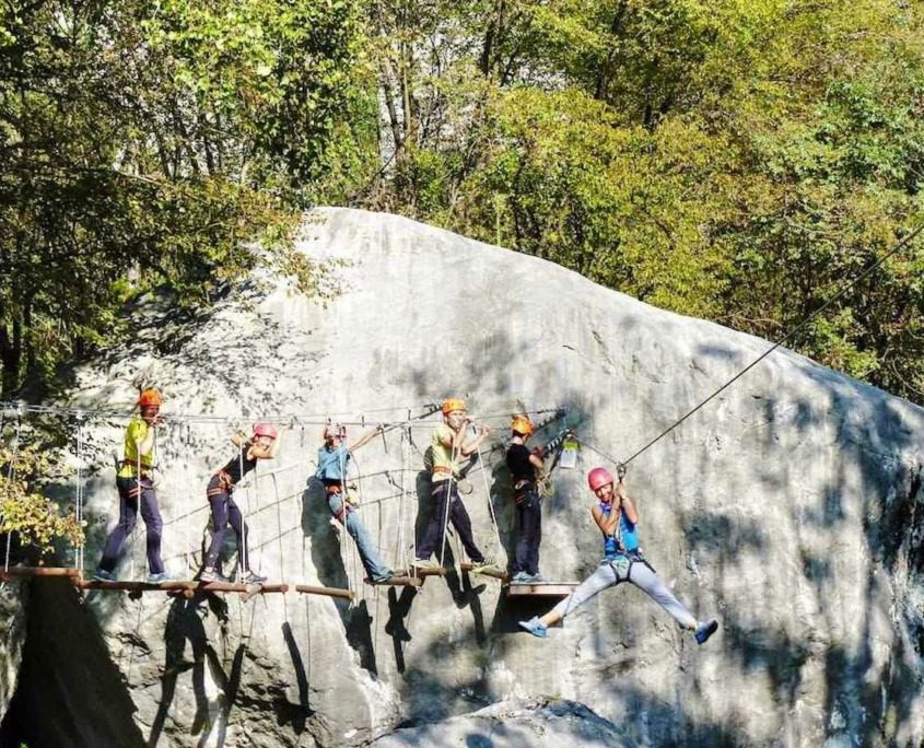 A group of people enjoying the adventure path at Elias Adventure Park near Lake Garda.