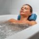 A woman lies in a therapeutic bath in Terme di Comano Wellness Center near Lake Garda.